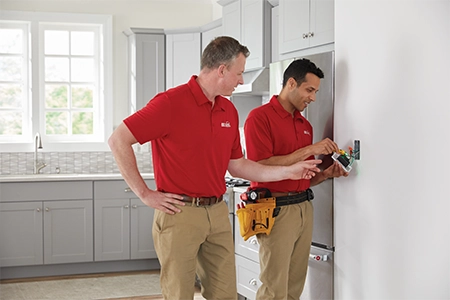 Ace Hardware Home Services electricians wiring an outlet Ace Hardware Home Services electricians wiring an outlet