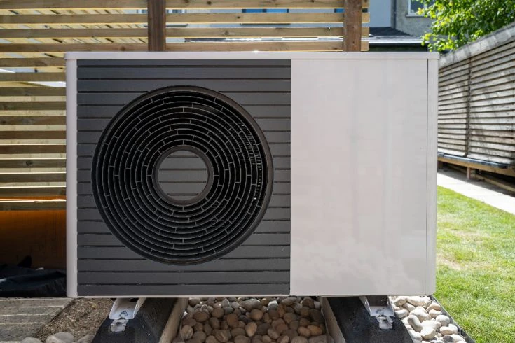 Residential heat pump installed outside of a home