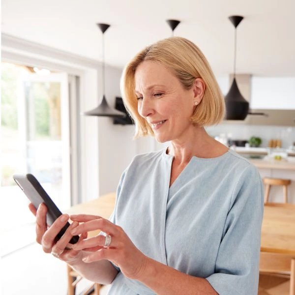 Using an app to control a smart thermostat Using an app to control a smart thermostat