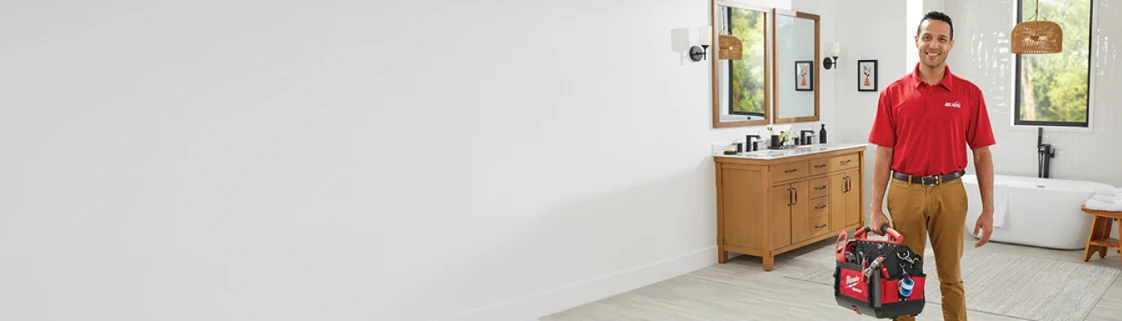 Plumber in bathroom