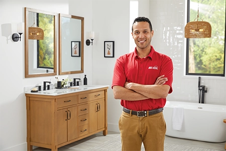 Ace Hardware Home Services plumber in a bathroom Ace Hardware Home Services plumber in a bathroom