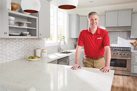 Ace Hardware Home Services plumber in a kitchen Ace Hardware Home Services plumber in a kitchen