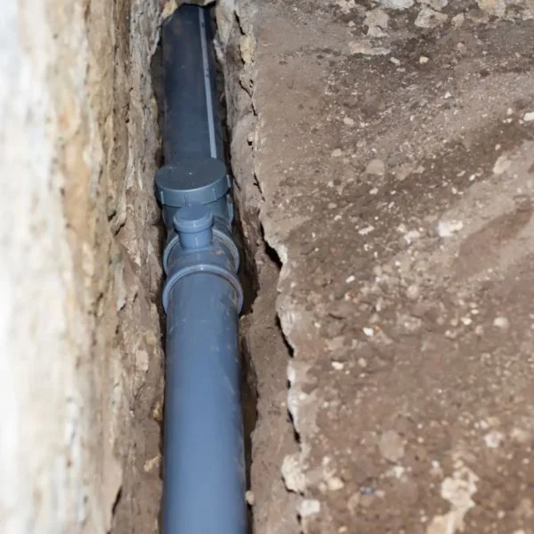 Drain line replacement via tunneling