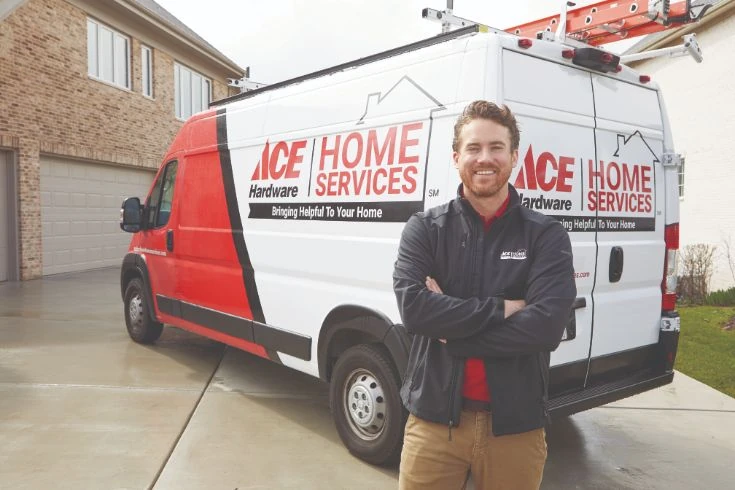 Ace Home Services plumber in front of AHHS truck