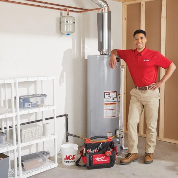 Ace Home Services plumber repairing a tank water heater Ace Home Services plumber repairing a tank water heater